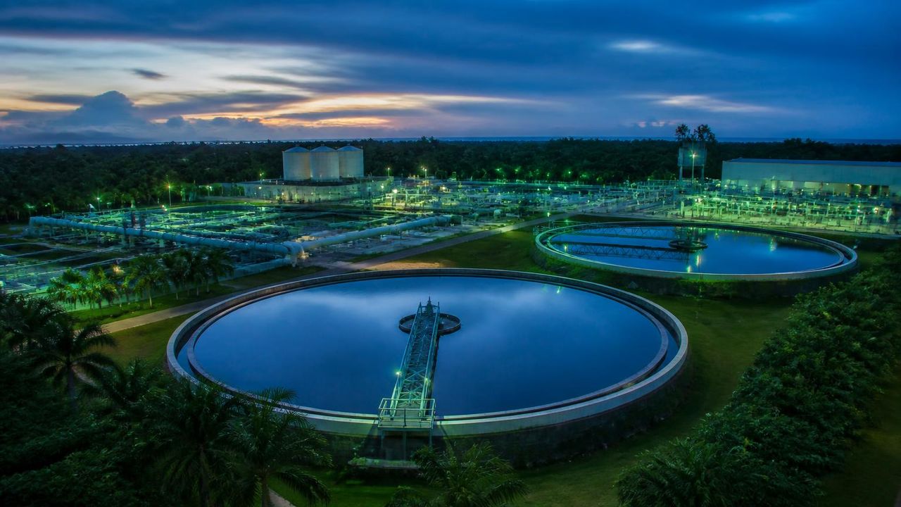 Anaerobic digesters, solar array and water reclamation clarifiers on the Eden Ghana campus